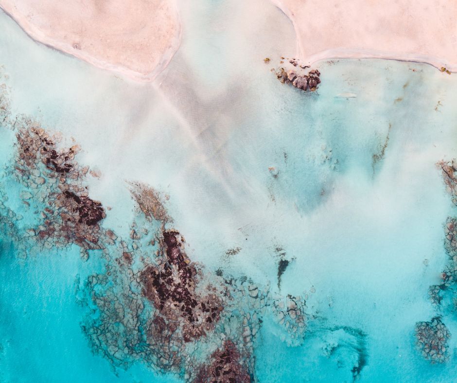 Where pink-hued sands meet crystal waters — a dreamlike escape to serenity.